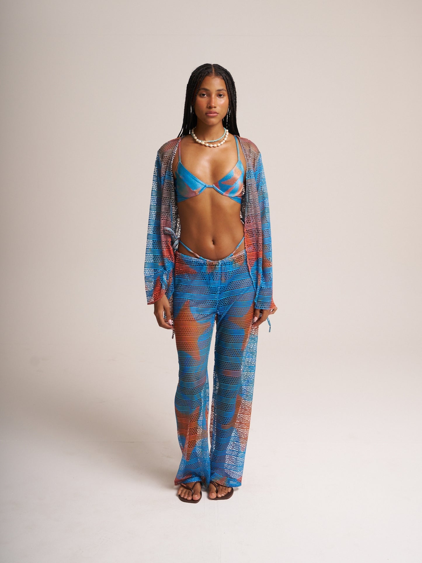 Blue Isla mesh set by Bahama Mama worn open over a bikini, studio front view