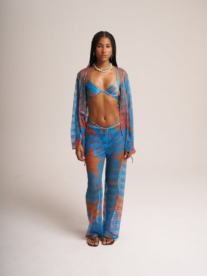 Blue Isla mesh set by Bahama Mama worn open over a bikini, studio front view