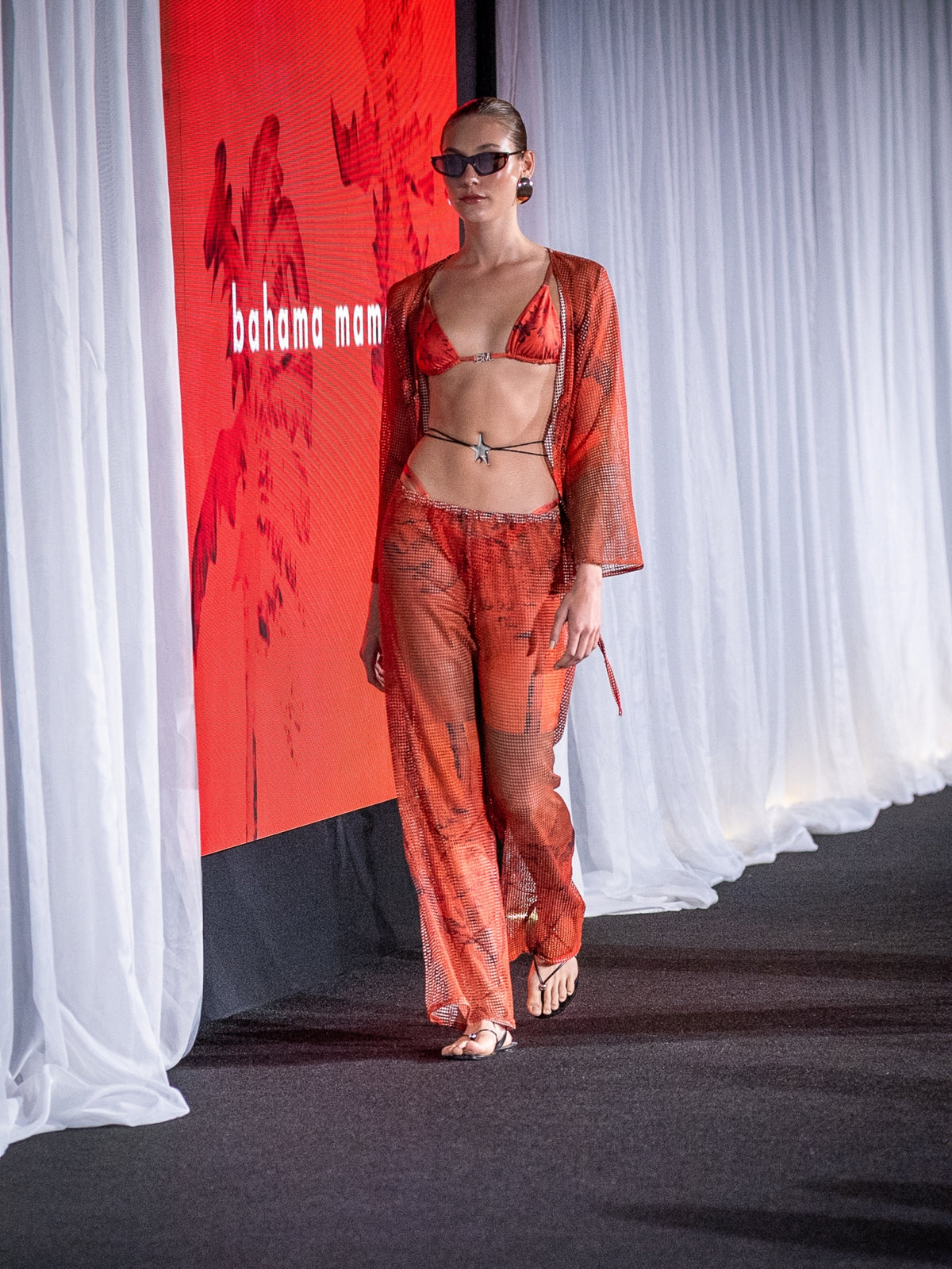 The red Isla mesh set by Bahama Mama on the runway at a brand presentation