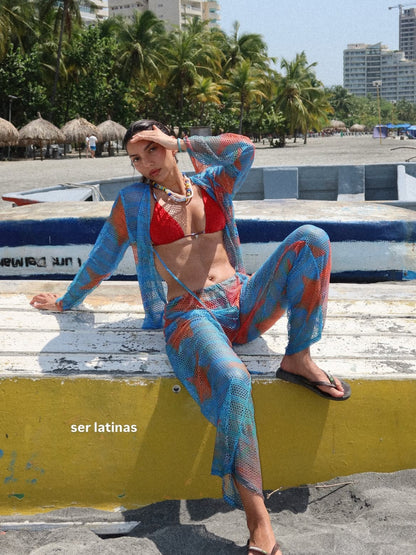 Blue Isla mesh set by Bahama Mama photographed sitting on a wall by the sea