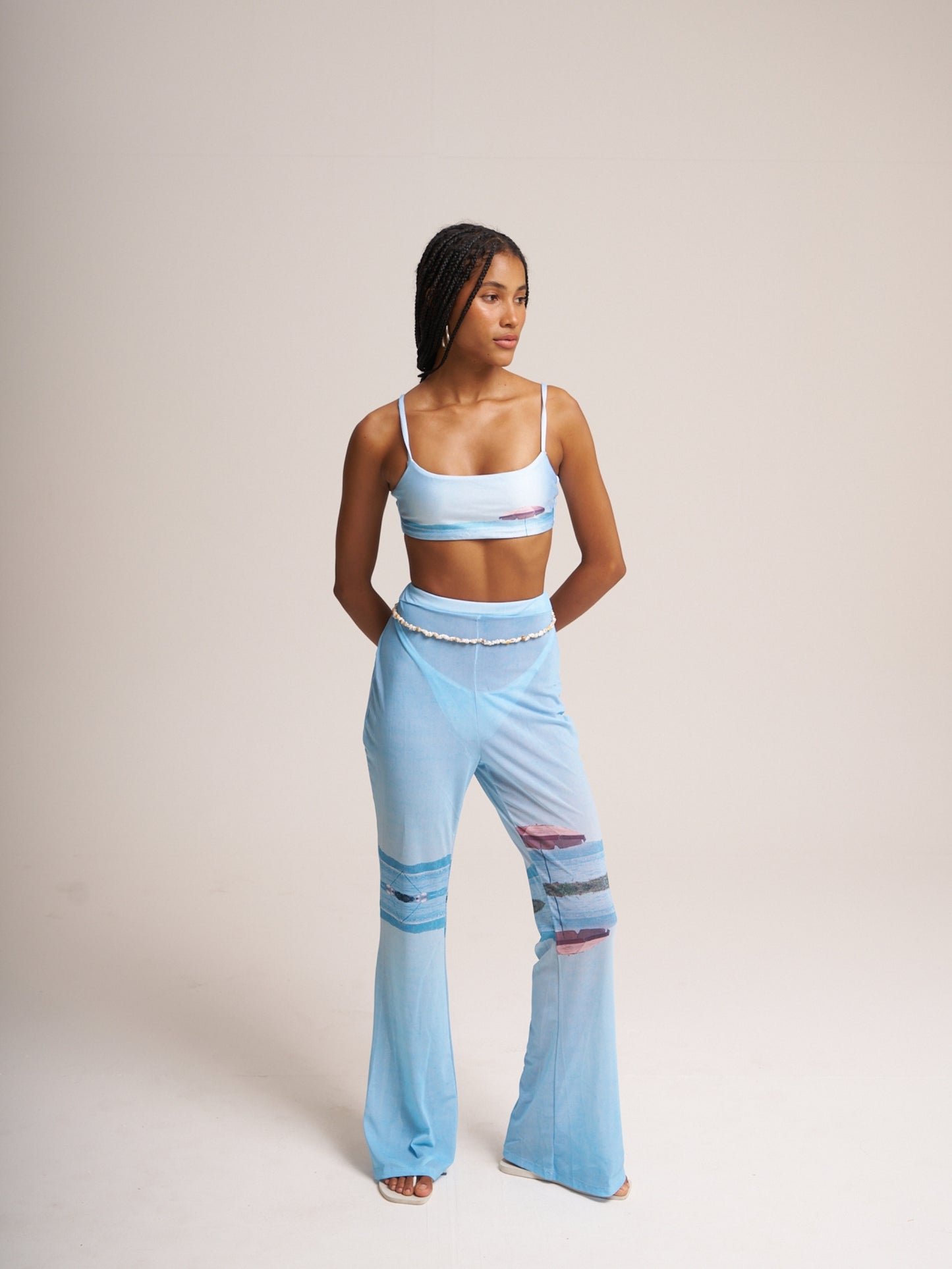 Pale blue Lambada mesh set by Bahama Mama, fitted top and low-rise flared trousers