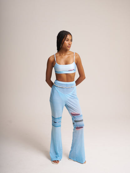 Pale blue Lambada mesh set by Bahama Mama, fitted top and low-rise flared trousers