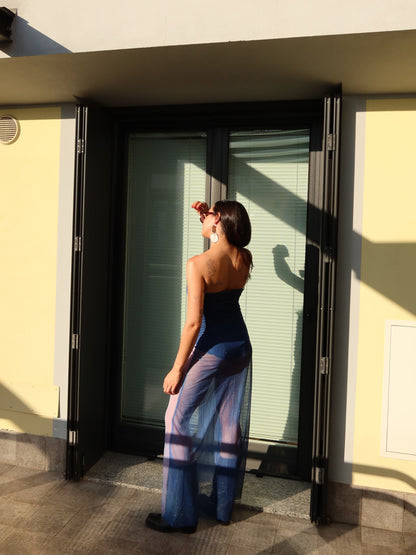 Back view of the Nocturna Dress by Bahama Mama, walking away in the sun