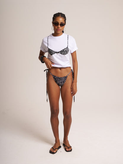 Model in the Arullo Surreal T-shirt by Bahama Mama with the matching black and white printed bikini bottoms