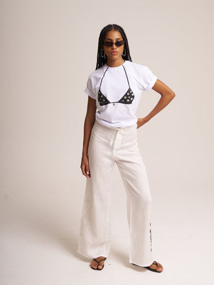 White Surreal T-shirt by Bahama Mama styled with white wide-leg trousers