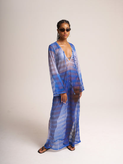 Titipan mesh cover-up by Bahama Mama worn open over matching blue mesh trousers