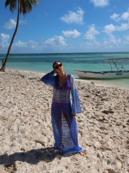 Titipan Cover Up by Bahama Mama on a Caribbean beach beside a wooden boat