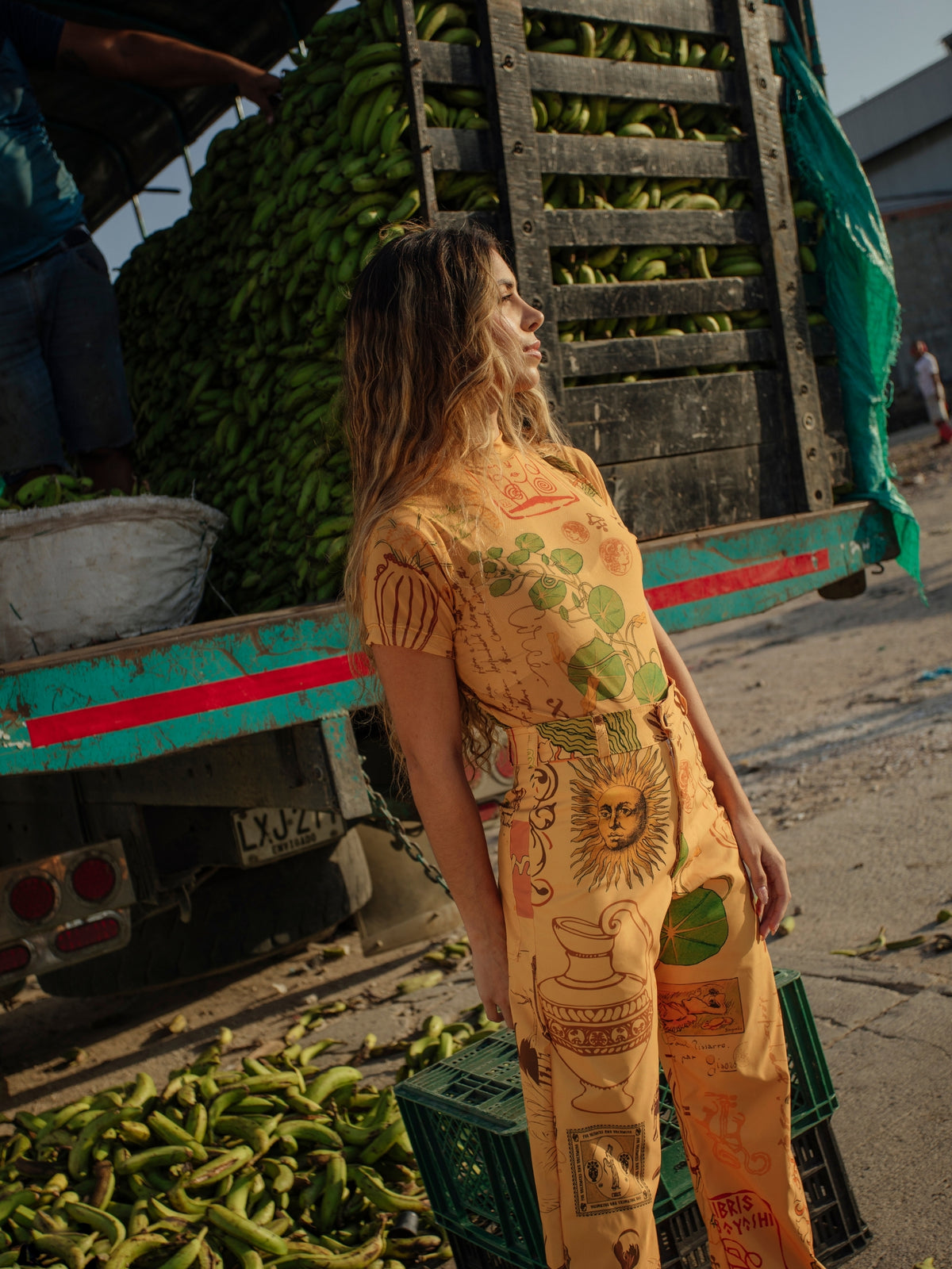 Circe Trofo ochre printed top and trousers photographed in profile at a market