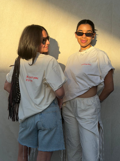 Two models in the Limited Edition CR T-shirt by Corazon Roto showing the slogan on the back