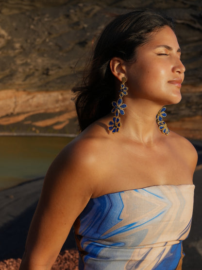 Profile view of the long Azulita beaded earrings by Dearly in cobalt blue and silver