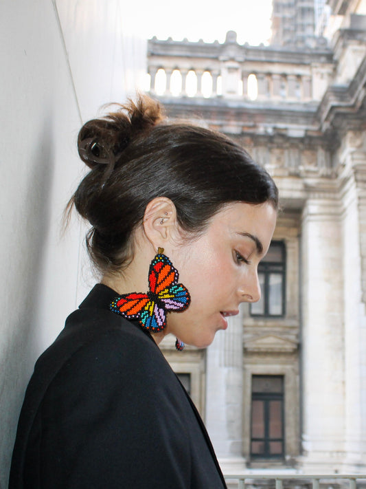 Mariposa Earrings by Dearly: hand-beaded butterflies in monarch orange and rainbow glass beads