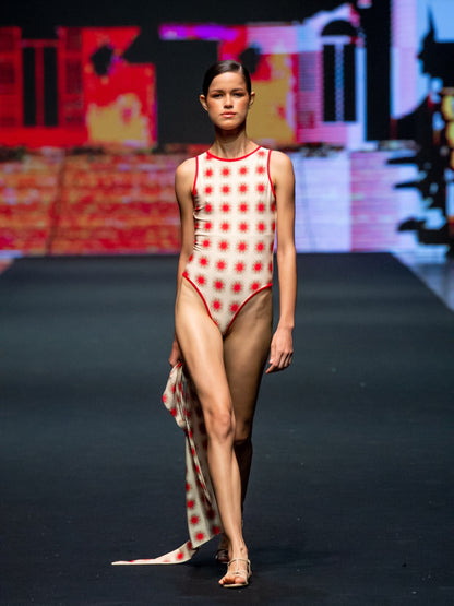 The Helena Star Red one-piece swimsuit by Encantadore on the runway