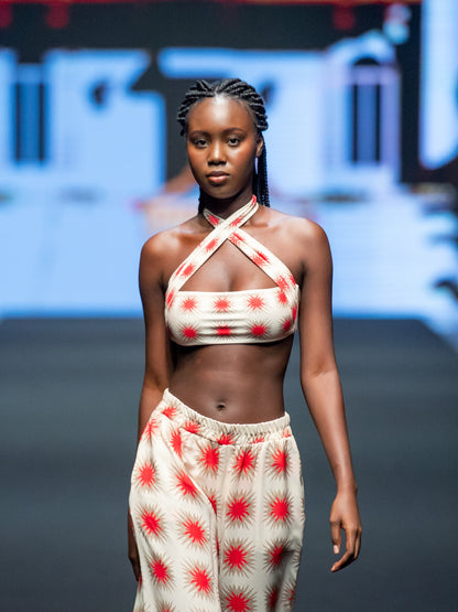 The Paola Star Red top by Encantadore worn on the runway with matching printed trousers