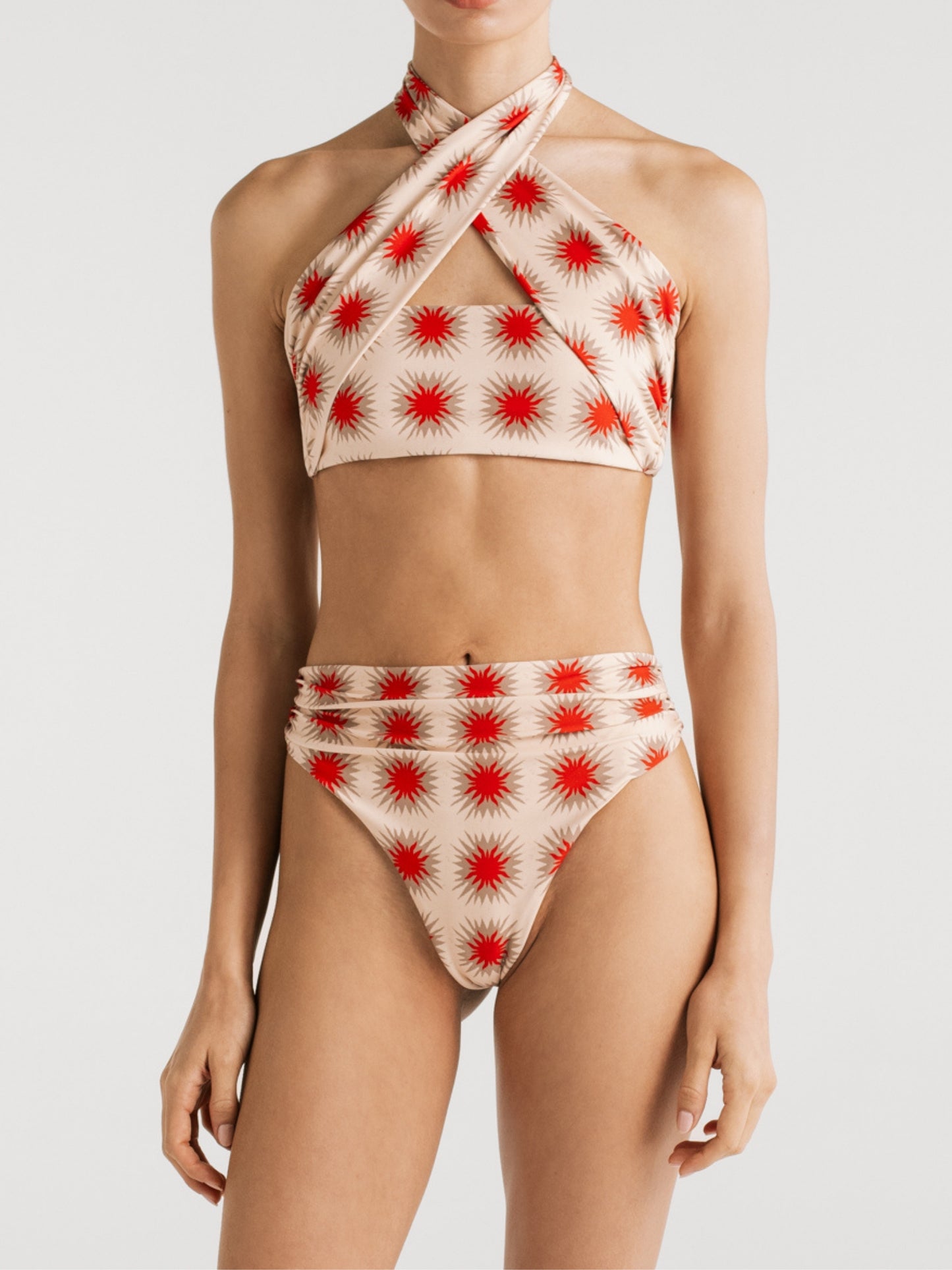 Esther Star Red high-waisted bikini bottom worn with the Paola cross-neck top by Encantadore
