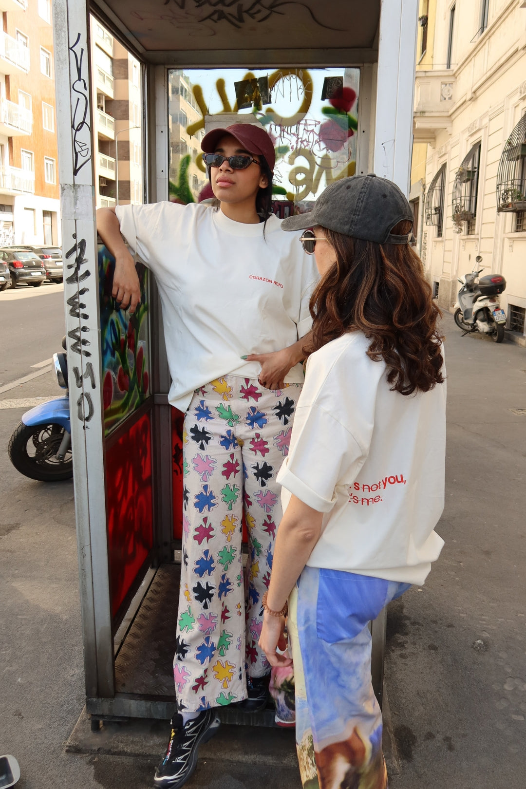 Two women wearing Limited Edition CR T-shirt cream oversized graphic tee, street style - Corazon Roto