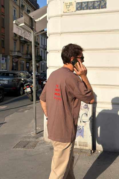 Man wearing Limited Edition CR T-shirt mocha oversized graphic tee back view street style unisex - Corazon Roto