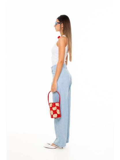 Side view of the This is Everybody's Town tank by Macondia with wide-leg jeans