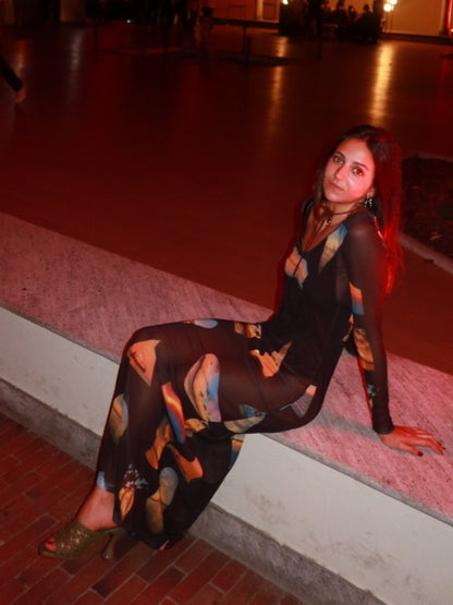 Macondia Sunsets mesh long dress worn at night in a red-lit street