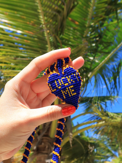 Close-up of the blue and yellow Lucky Me beaded heart by PÁJARA PINTA