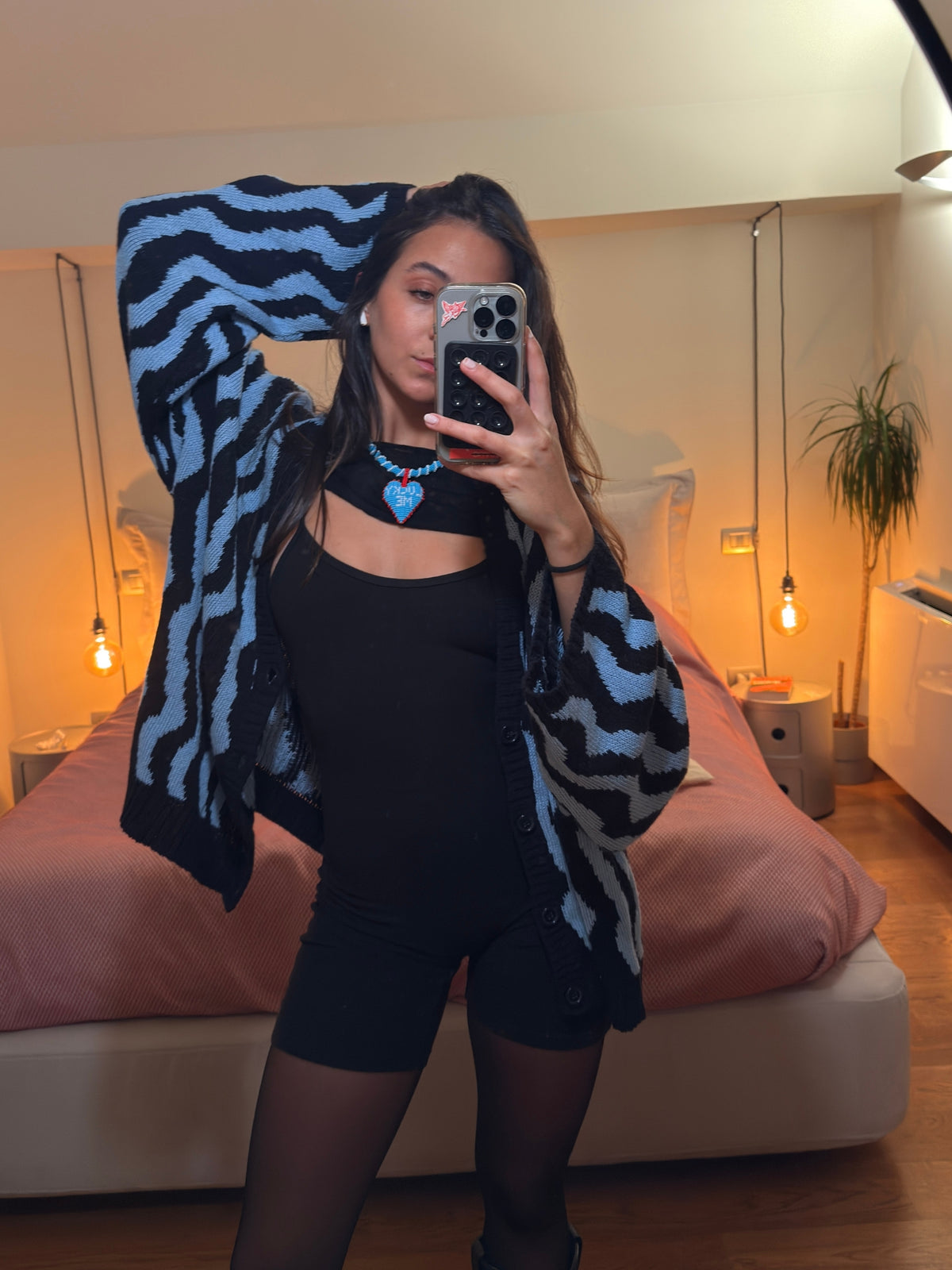 Short Lucky Me beaded heart necklace by PÁJARA PINTA worn with a black bodysuit