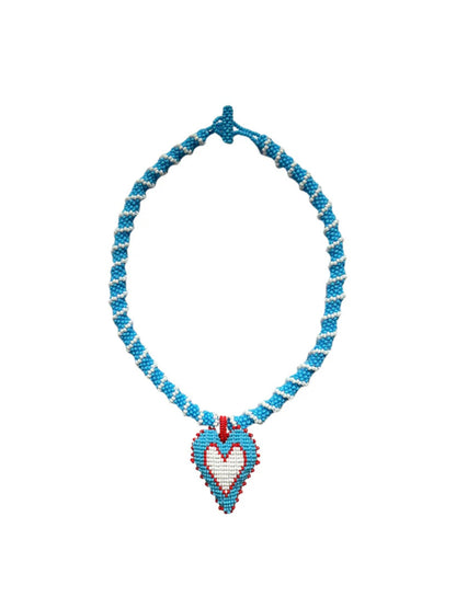 Detail of the light blue Lucky Me beaded heart choker by PÁJARA PINTA