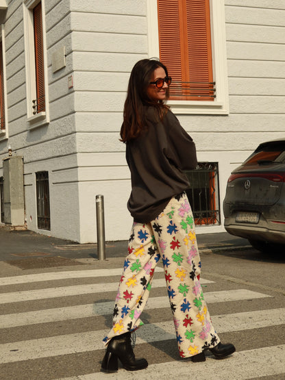 SIXXTA Amulet Chill Jeans worn with a dark jumper at a pedestrian crossing
