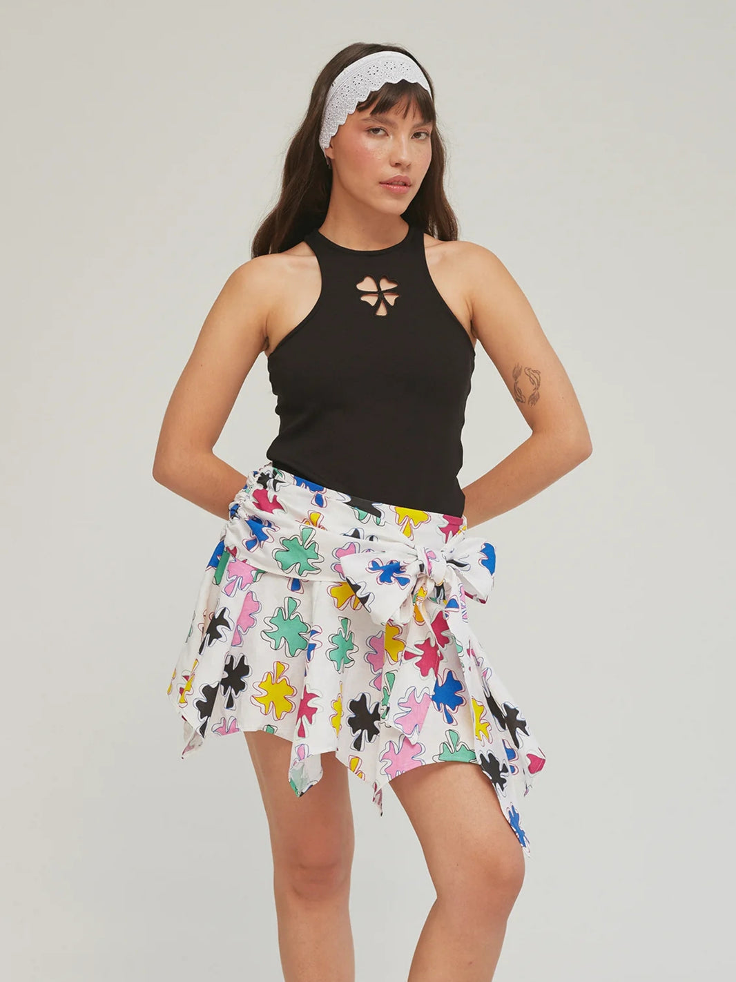 Amulet Mountain Skirt by SIXXTA: a short linen-blend skirt printed with hand-drawn clovers