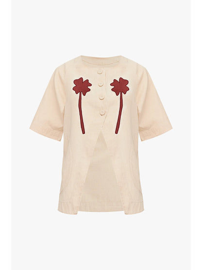 Product shot of the Clover Fortune Top Red by SIXXTA in cream cotton