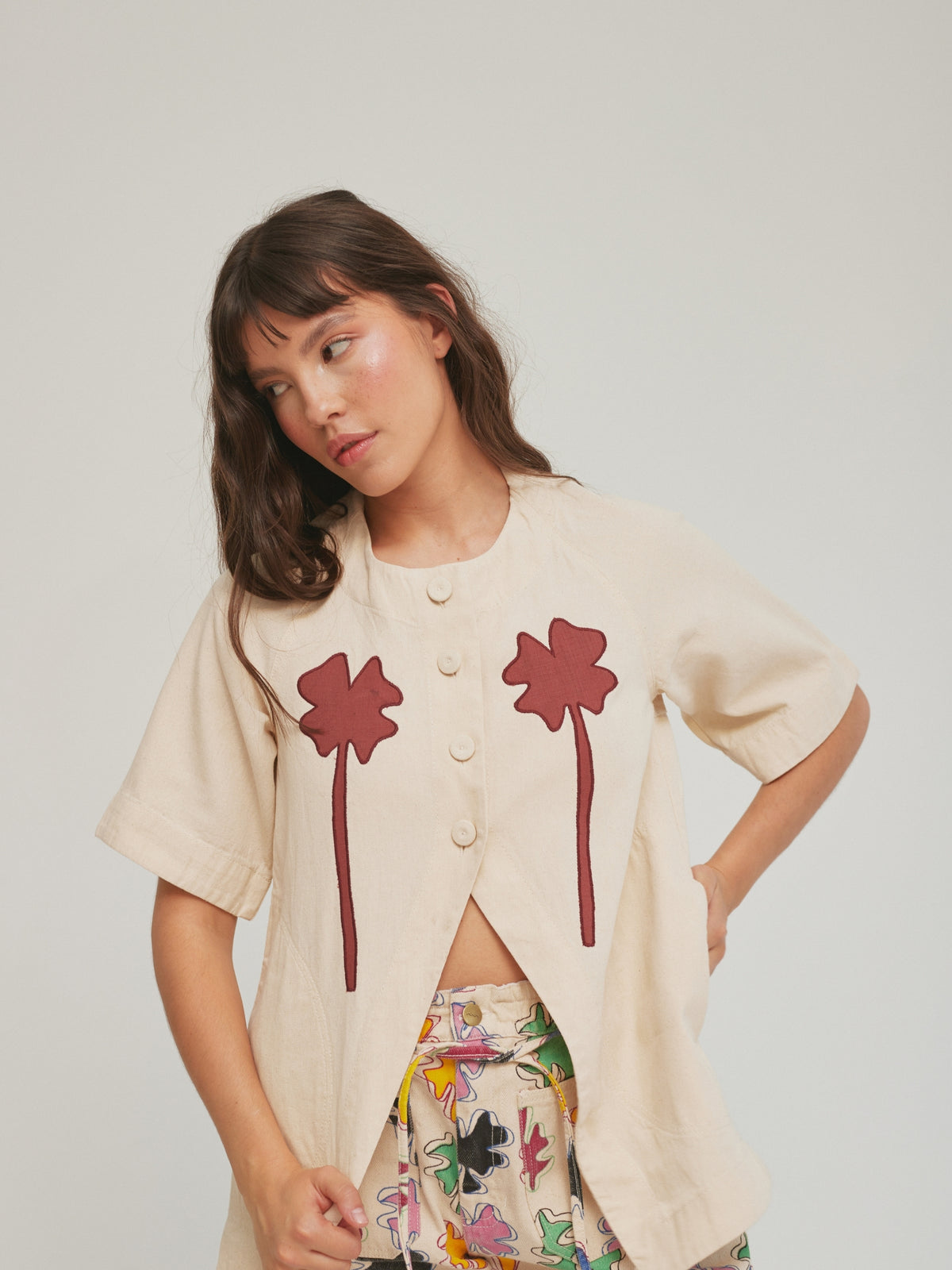 Clover Fortune Top Red by SIXXTA: a cream cotton top with two deep red clover appliques