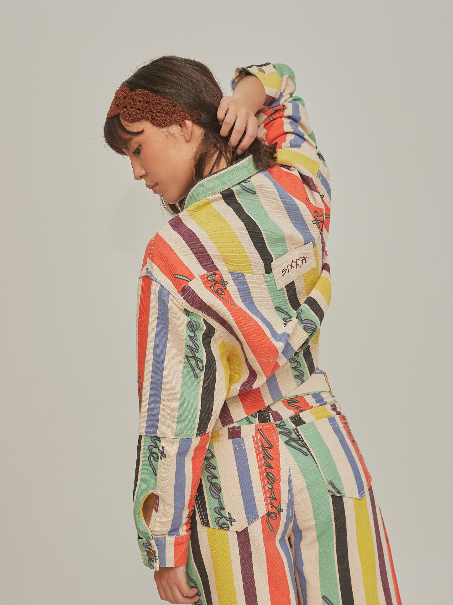 Product shot of the Good Luck Jacket by SIXXTA in painted multicolour stripes