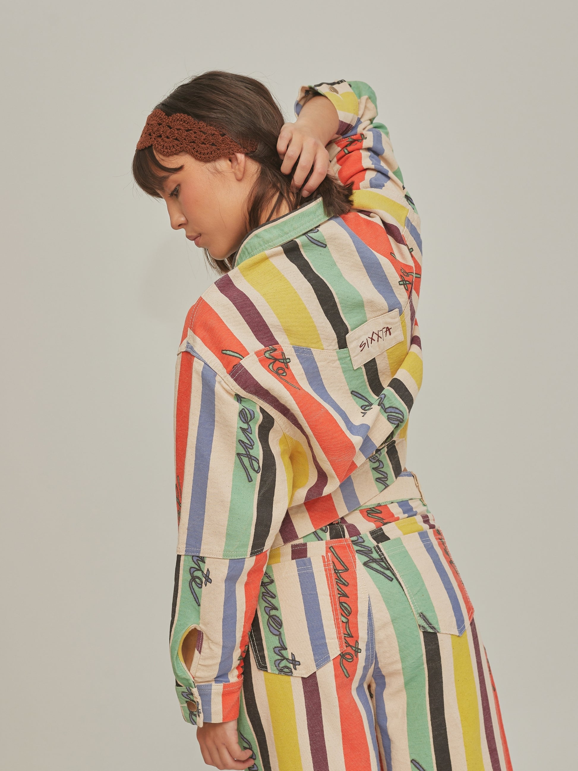 Product shot of the Good Luck Jacket by SIXXTA in painted multicolour stripes
