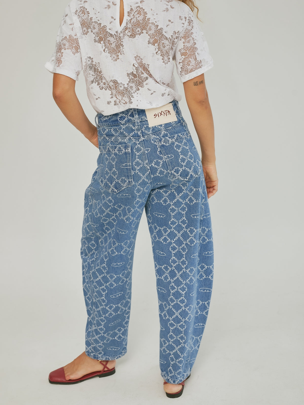 Back view of the SIXXTA Panes Huevito Jeans in printed denim