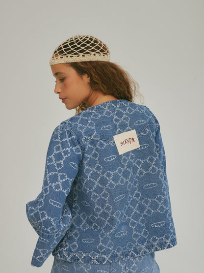 Back view of the SIXXTA Panes Jean Top showing the woven label