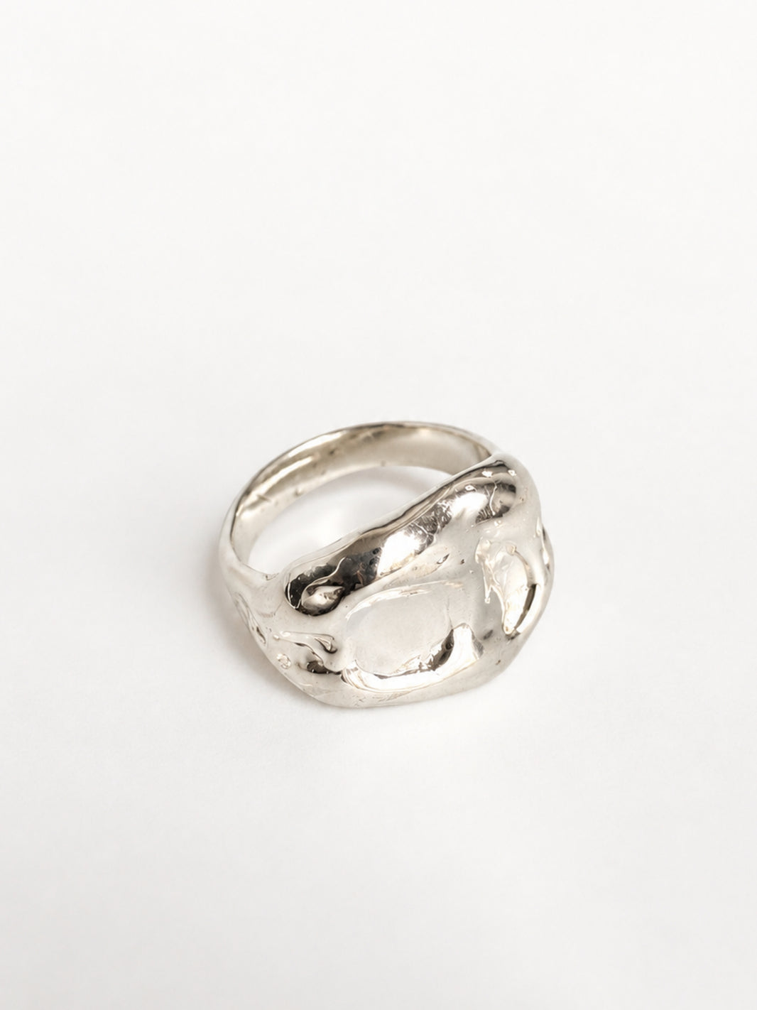 Chunky Ring by STUDIO MUREA: a wide 950 silver band with a rippled, organic surface, on a white background