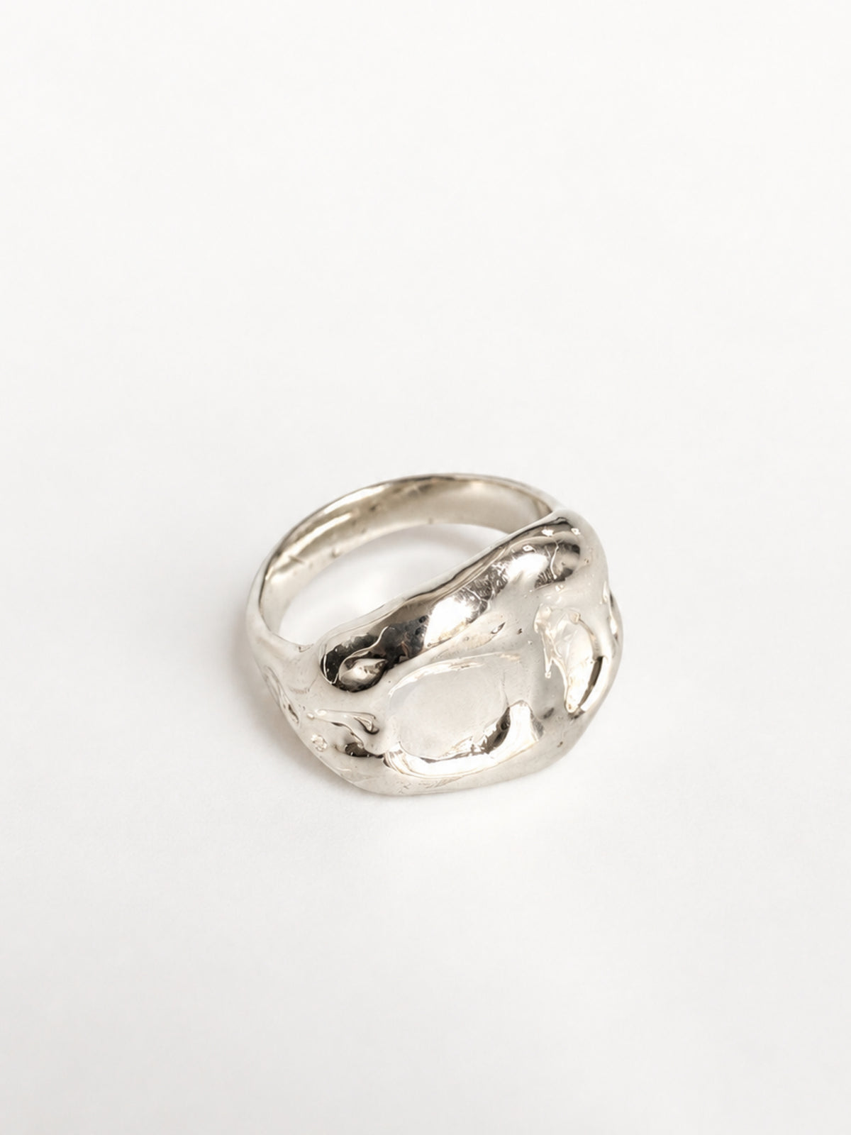 Chunky Ring by STUDIO MUREA: a wide 950 silver band with a rippled, organic surface, on a white background