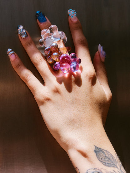 Several VOLD Bubbles glass rings worn together on one hand