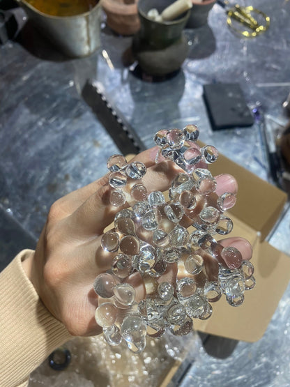 A handful of VOLD Bubbles Transparent glass rings in the workshop