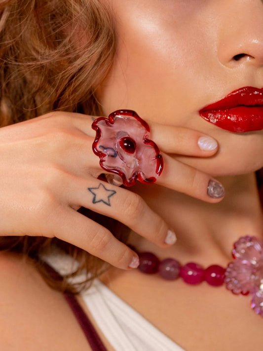 VOLD Candy Flower Ring worn with a matching beaded necklace and red lipstick