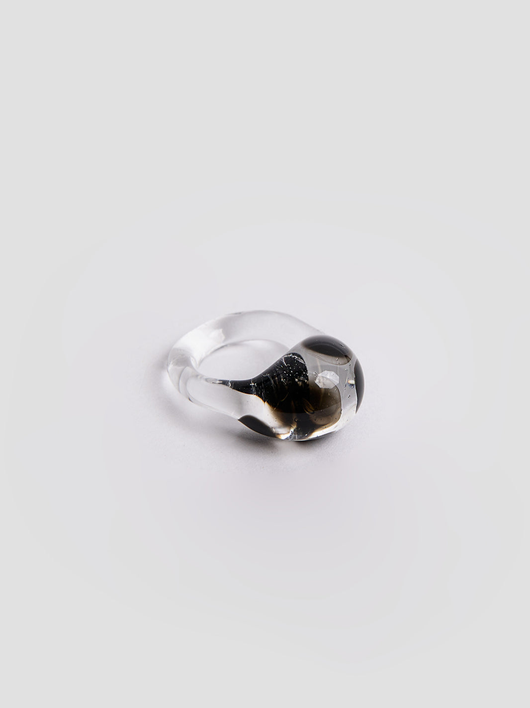 Dalmatian Ring by VOLD: a clear glass band with a black and white spotted pattern