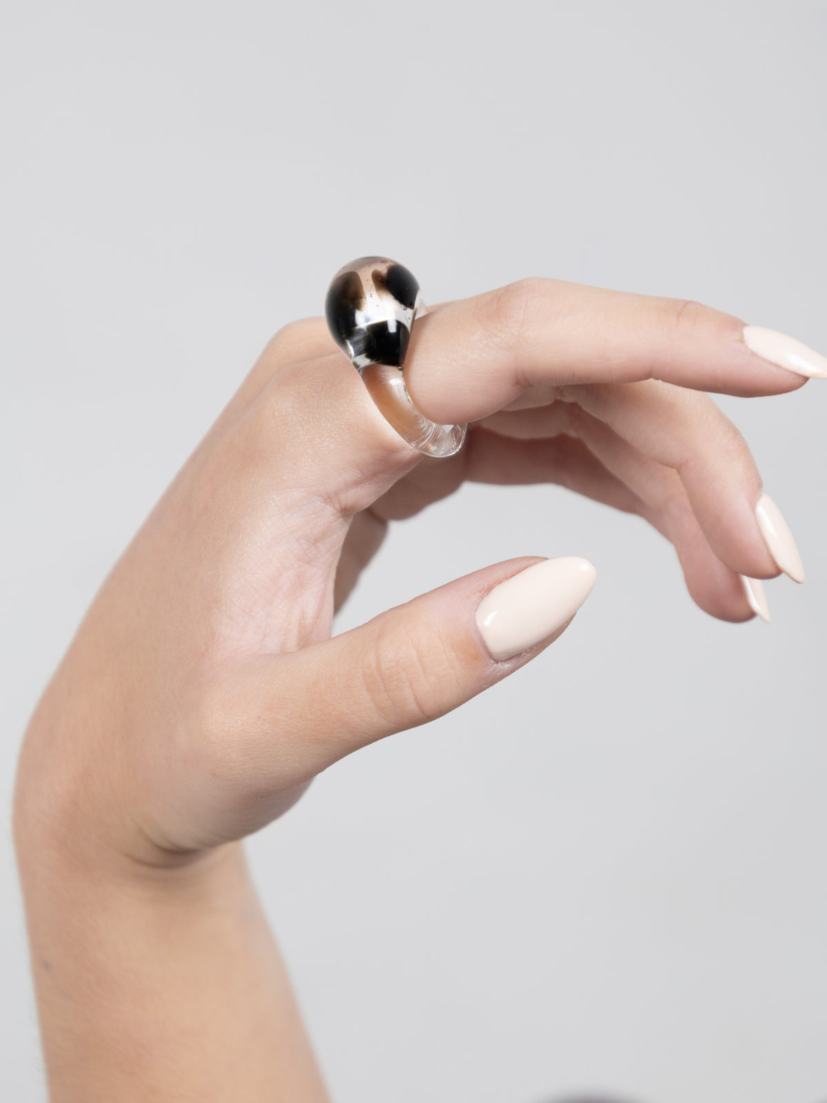 VOLD Dalmatian glass ring worn on a finger