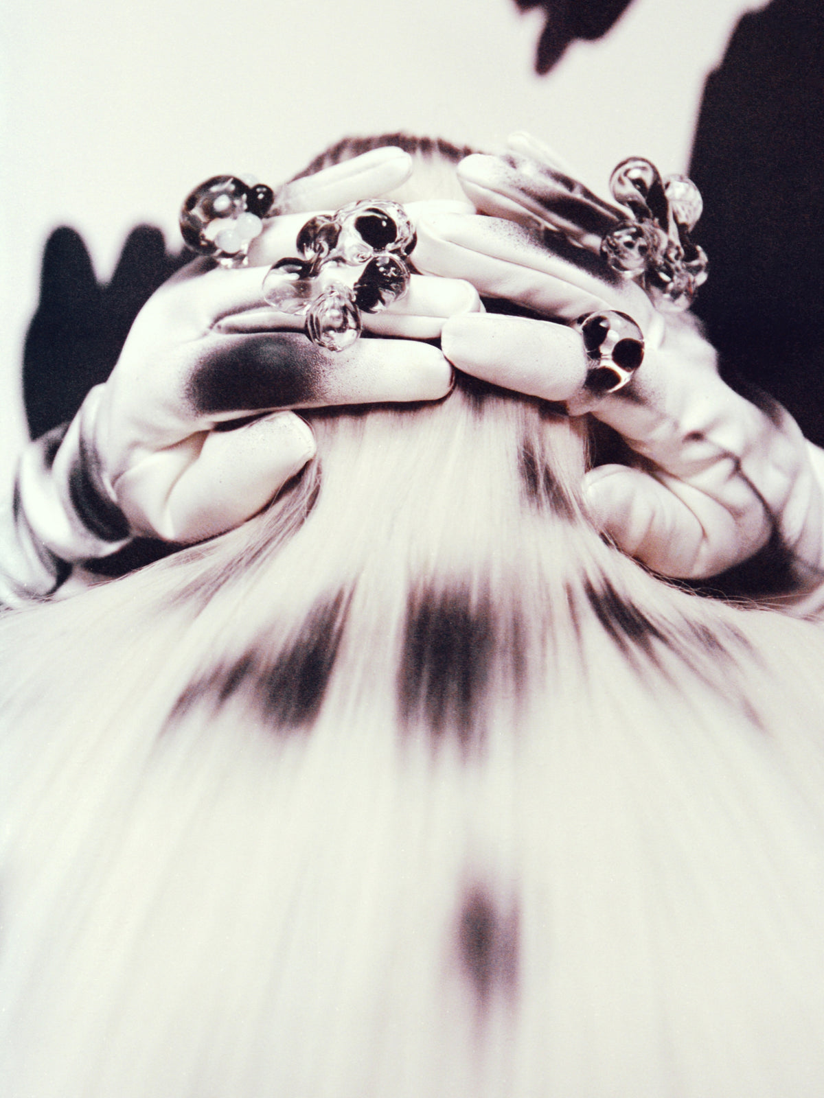 VOLD Dalmatian glass rings worn on gloved hands in a black and white editorial shoot
