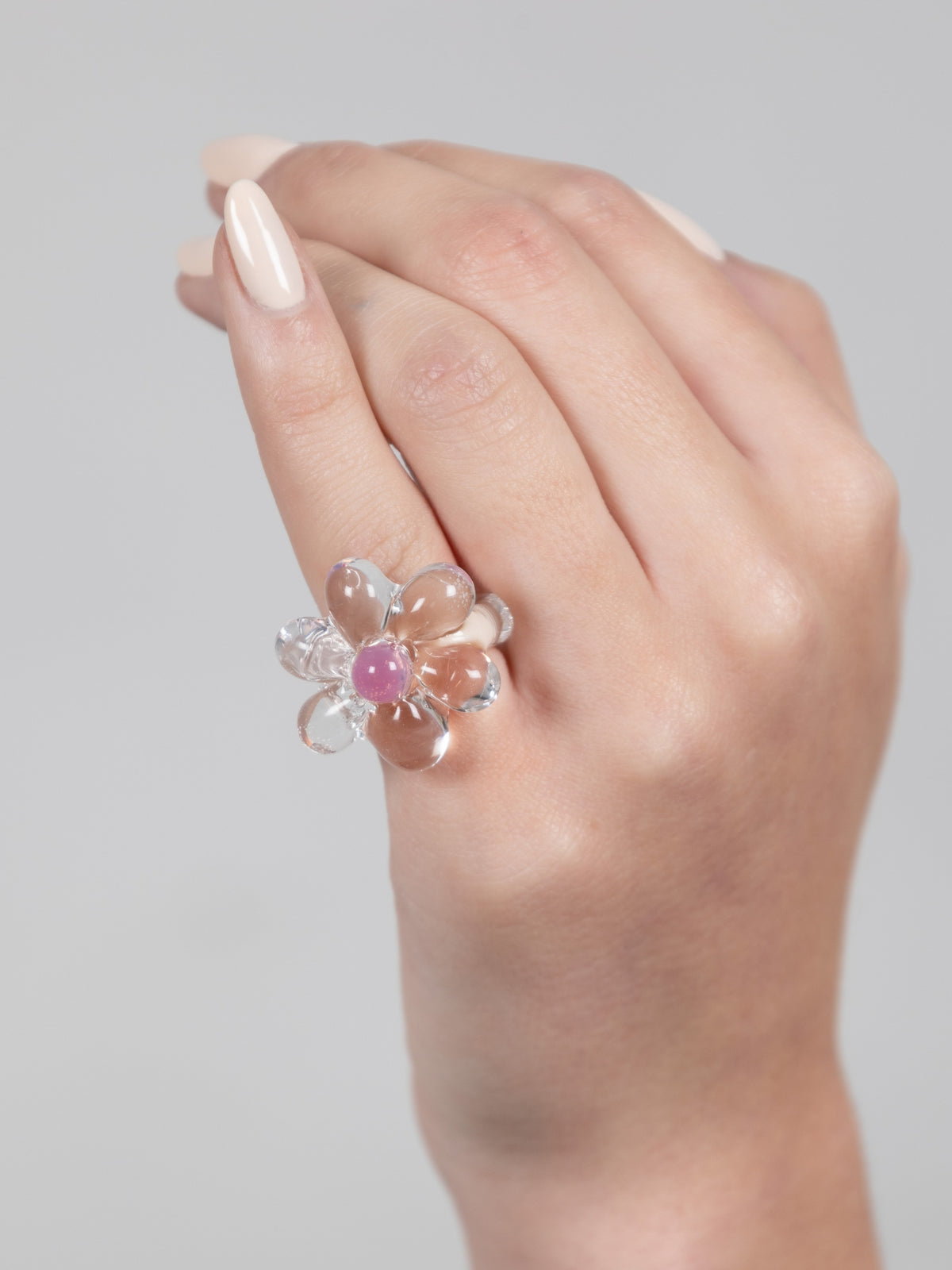 VOLD Ice Flower clear glass flower ring worn on a hand